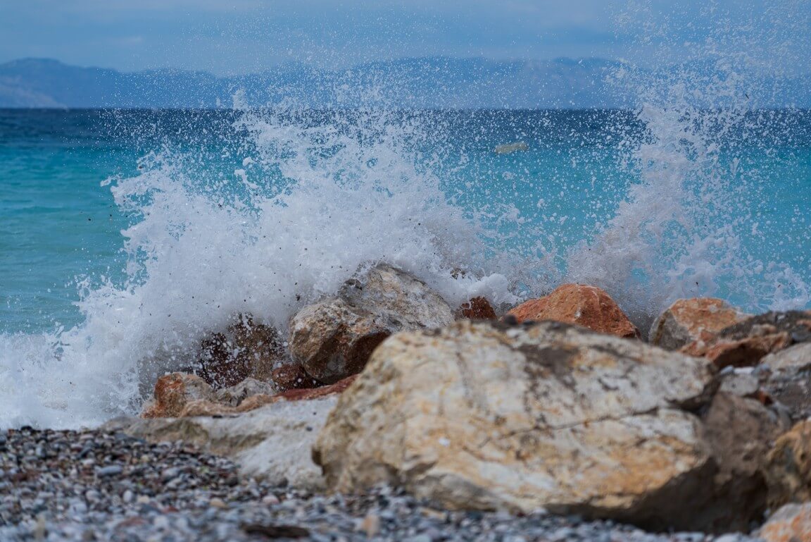 wave hitting rocks
